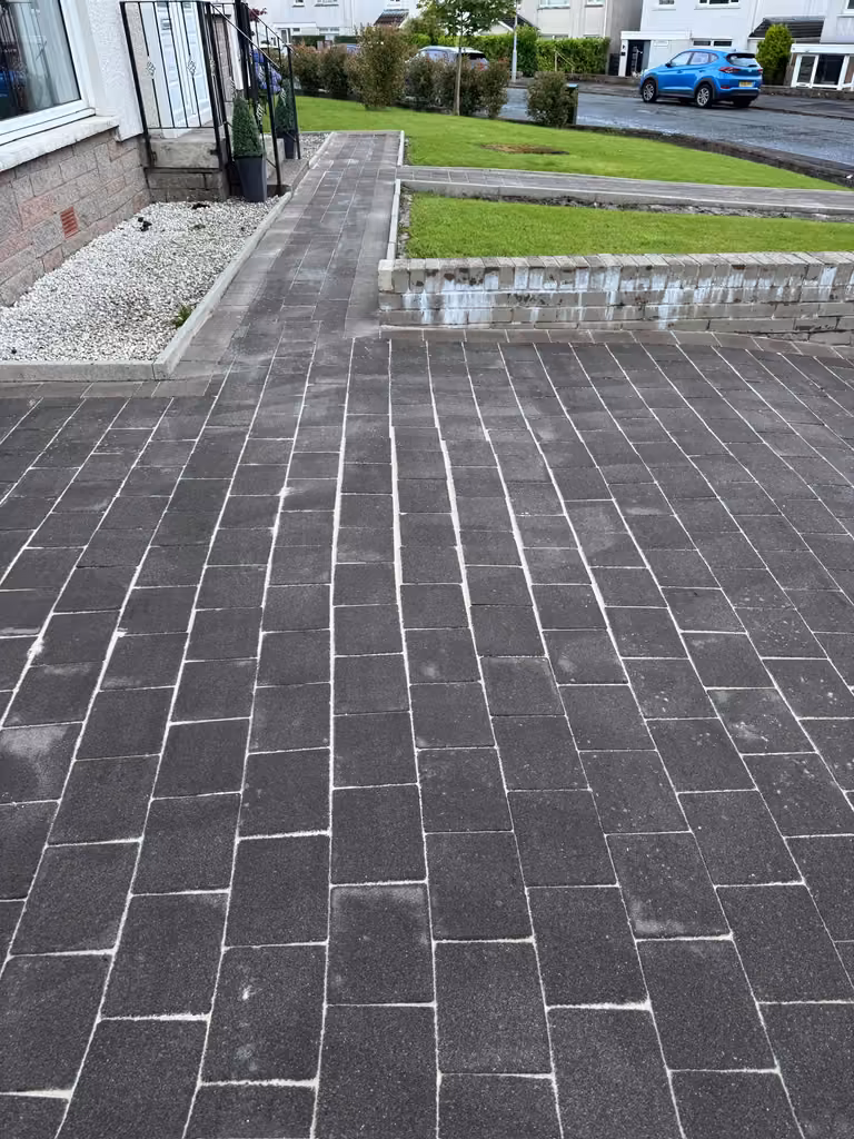 Clean block paving driveway after pressure washing