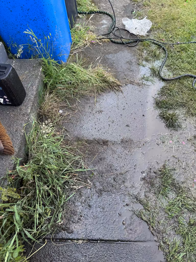 Dirty paving slabs before pressure washing
